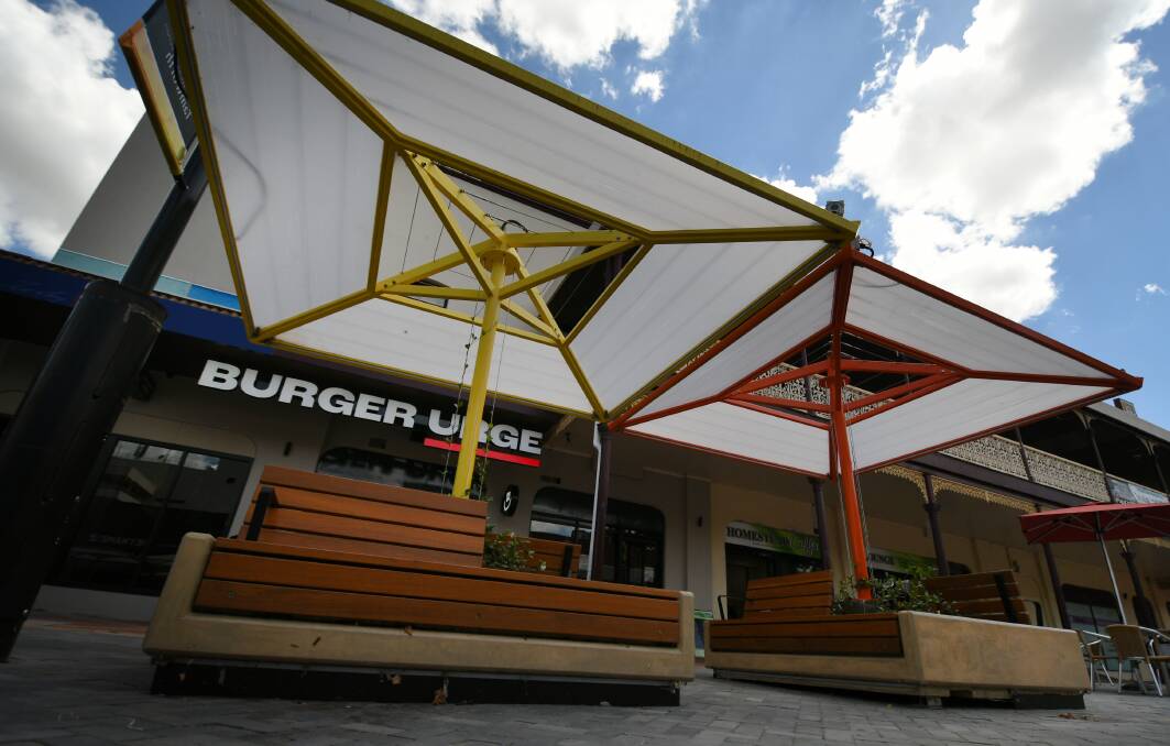 TAKEN DOWN: Umbrellas in Fitzroy Plaza will be removed for Burger Urge to have outdoor dining. Photo: Gareth Gardner