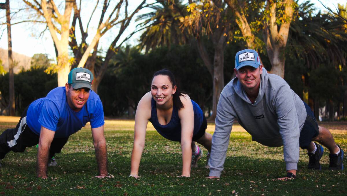CHALLENGE: Pete Anderson, Ashleigh Walton and Chris Hadden are in the Tamworth push up challenge team. Photo: Madeline Link