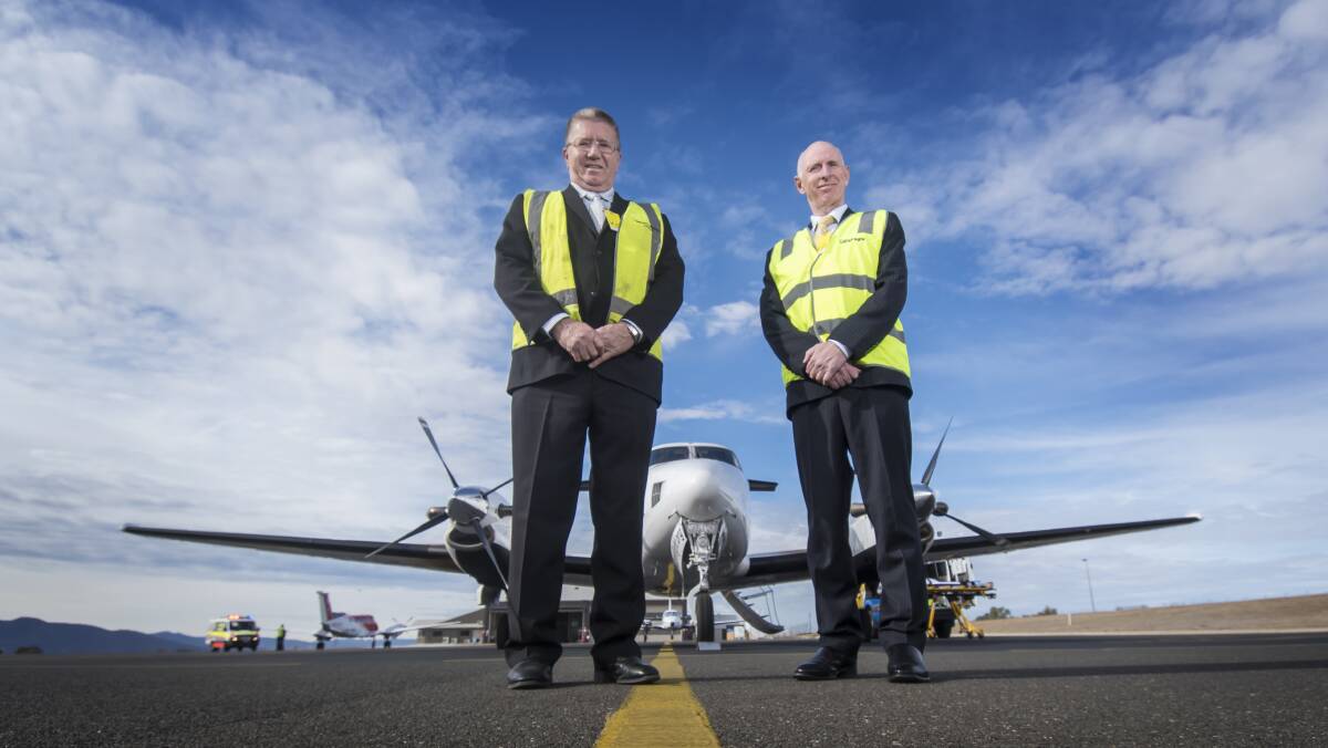 TOUCHDOWN: Tamworth Regional Council mayor Col Murray with Careflight chief executive Mick Frewen on the tarmac at the airport. Photo: Peter Hardin 
