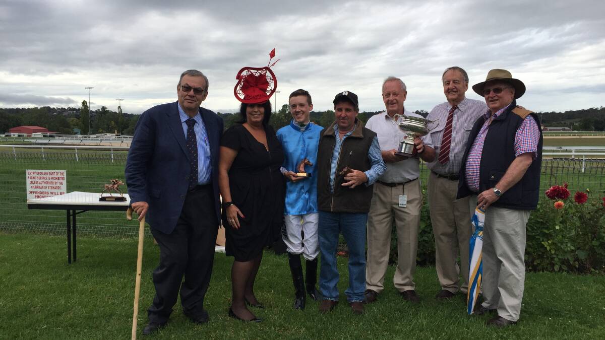 Feature win: Jockey Jackson Murphy and trainer Paddy Cunningham pose with officials after winning Monday's Armidale Cup thanks to Carry Me Jake. Photo: Matt Bedford