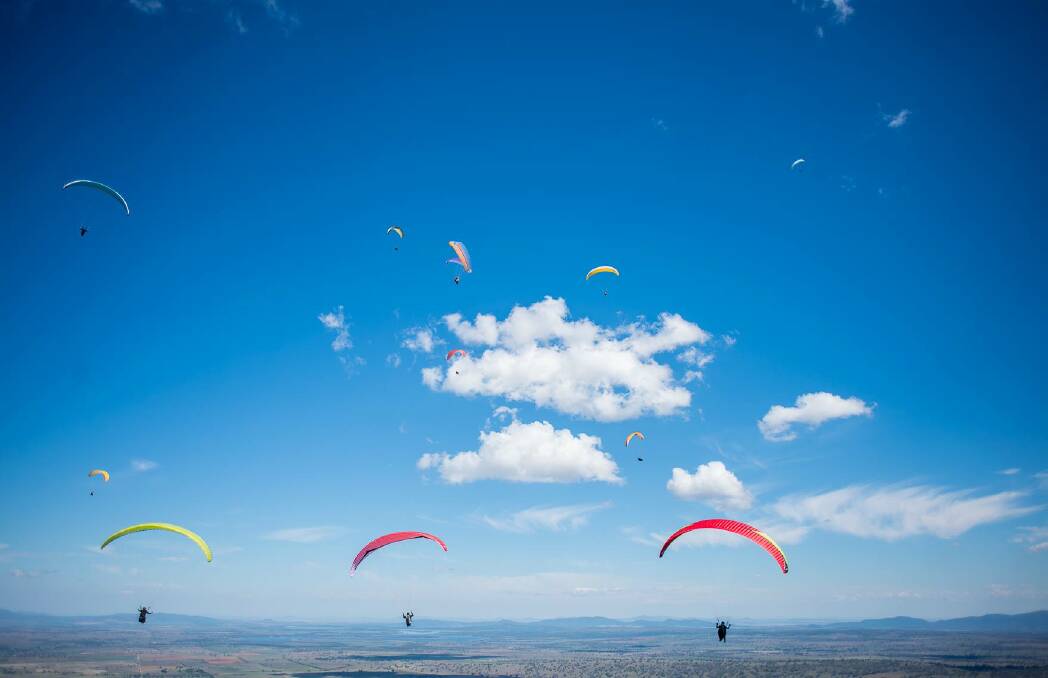 Is it a bird: Or a plane, no, it is the field of paragliders, who took to the skies from Mt Borah in Manilla for the annual State of Origin challenge.