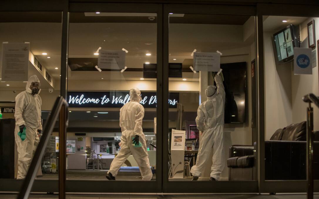 UNWELCOME SIGHT: Cleaners get to work after the Sydney visitor's attendance last week. Picture: Marina Neil