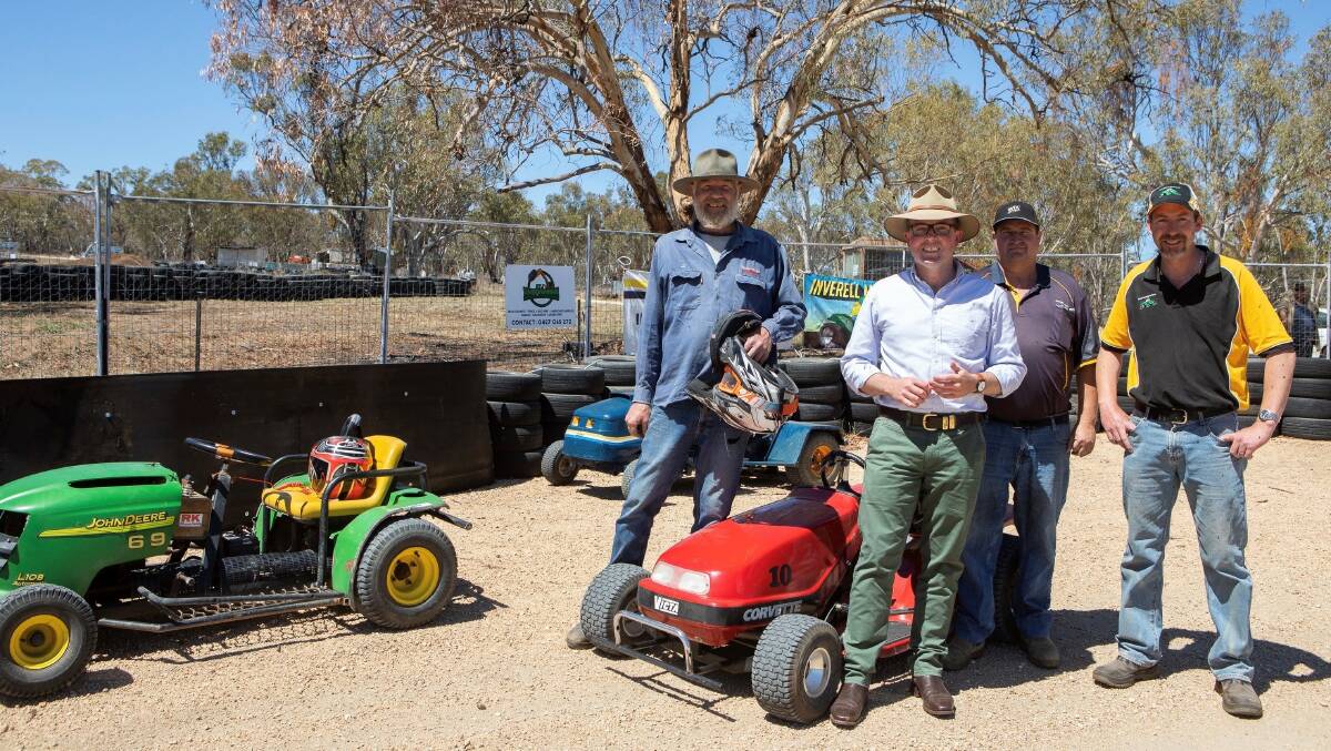 Inverell Mower Racing Club members Glen Davidson, left, Craig Wilkins and Brad Hanna with Northern Tablelands MP at the track this week, which Mr Marshall tried out for himself.