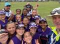Tamworth Junior Oztag licensee, Bill Harrigan, with the under 11s girls team in Coffs Harbour over the weekend. Picture supplied.