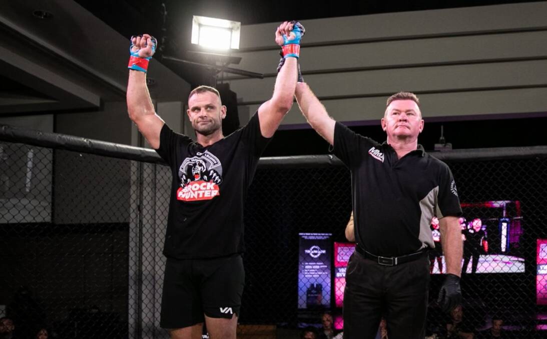 Winner: Brock Hunter's arm is raised after his standout performance against Byron Wilcox at the Southport Sharks. Photo: Proving Grounds Fight League/Emperor Creative.
