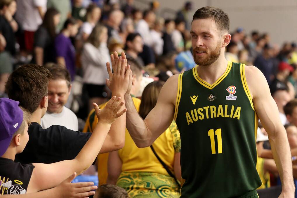 Nick Kay celebrates with fans after leading the Boomers to a 45 point win in their final World Cup qualifier against Kazakhstan in February. Picture Kelly Defina/Getty Images.