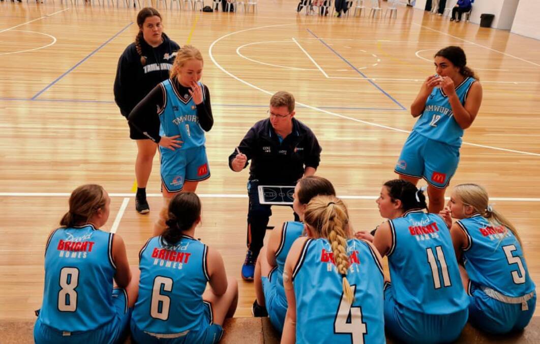 Team talk: Scott Ward takes the Tamworth girls through the game plan during last weekend's tournament in Bathurst. Photo: Tamworth Basketball Association Facebook.