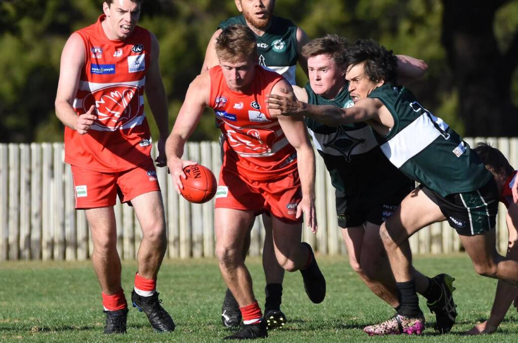 Cody Beresford breaks through a tackle during the Swans' win over the New England Nomads on Saturday. Picture AFL North West Facebook.