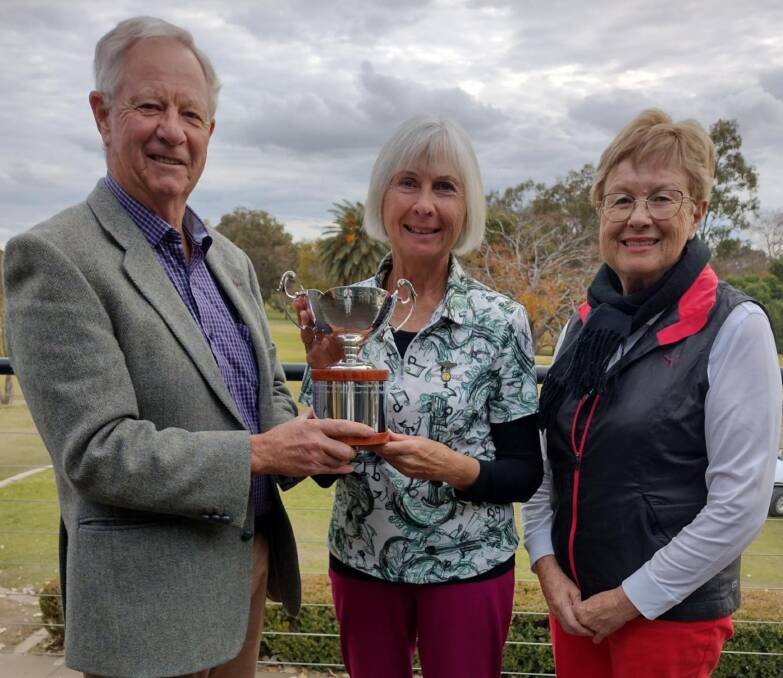 Big winner: Stephanie King (centre) is presented the Treloar Cup by John and Janet Treloar after her victory last week. Photo: Supplied.