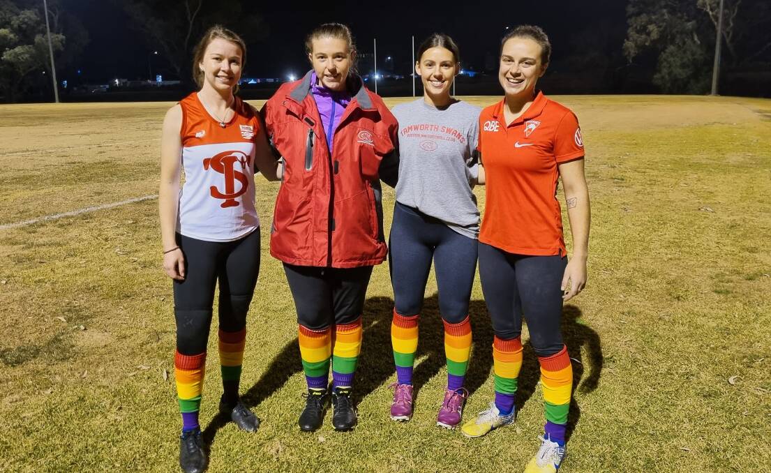 Team support: O'Brien's fellow Swans players (from left) Grace Maher, Bryttany Frost, Madison Sharp, and Hannah Lye all intend to don the rainbow socks this weekend. Photo: Zac Lowe.