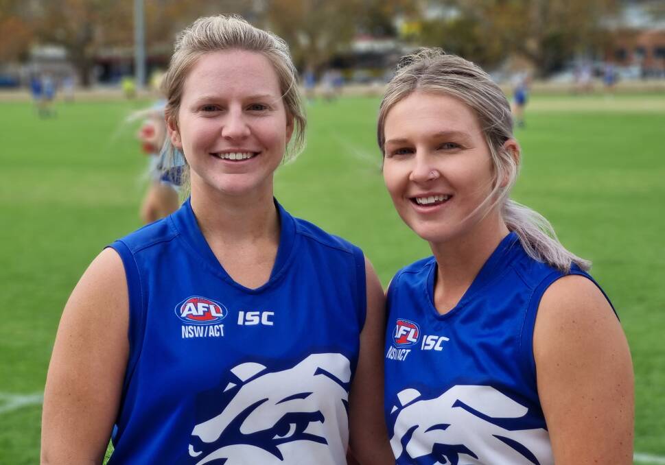 Sisters in arms: Khobi (left) and Braie Devine have always wanted to play football together, and finally got the chance to do so for the Gunnedah Poochettes this year. Photo: Zac Lowe.