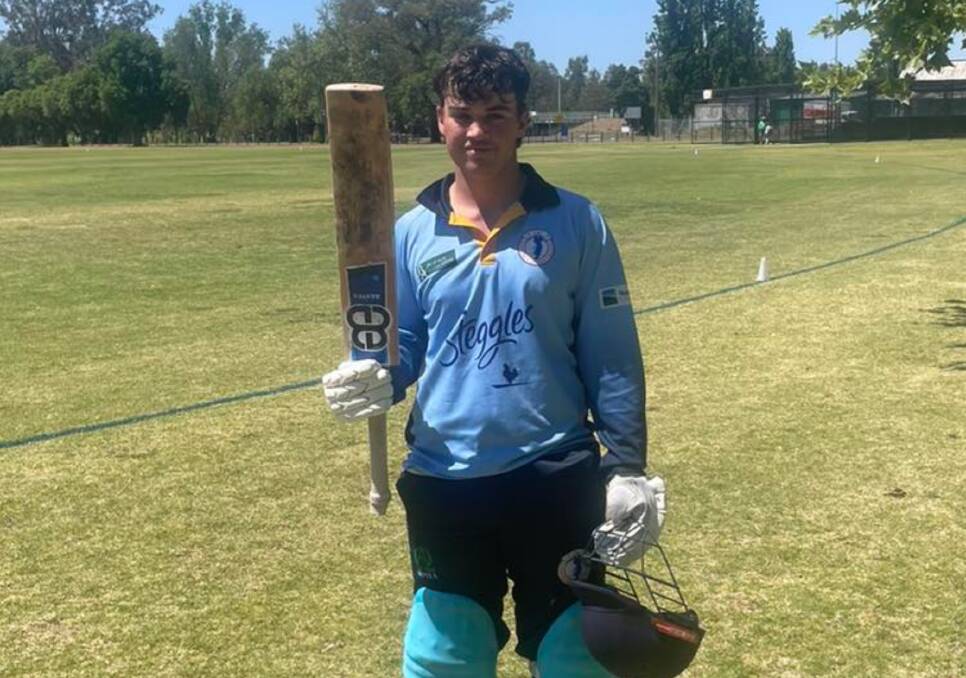 Archie McMaster celebrates his century in the first round of the John Kilborn Shield, which was the first made with one of Mark Johnson's bats. Picture by Tamworth Junior Cricket.