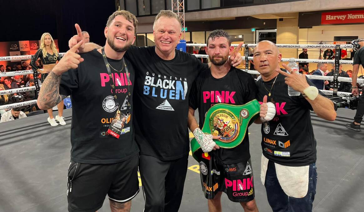 Albert Nolan (second from right) celebrates with coach David Syphers (second from left) and the Black 'n' Blue Boxing team after his win last month. Picture by Black 'n' Blue Boxing.
