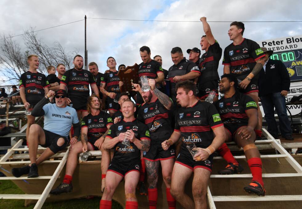 Jake Vost (front row, second from left) celebrates North Tamworth's 2022 premiership win with the team after defeating the Dungowan Cowboys 22-14. Picture by Gareth Gardner. 