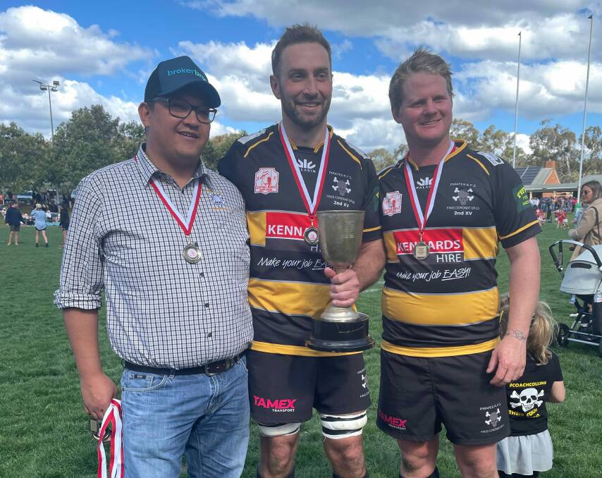 (From left) Pirates co-coach Joe Stolker, captain Tony O'Connor, and co-coach Sam Collins shortly after their grand final win. Picture by Samantha Newsam.