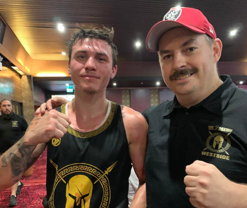 Cody Vitalone with coach Jaime Carroll after his winning effort in Sydney over the weekend, in which he scored a decision victory against a very tough opponent. Picture supplied.