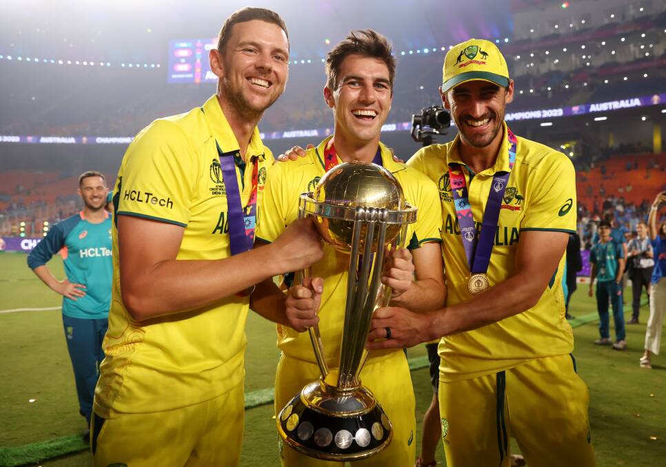 Josh Hazlewood (left) celebrates Australia's sixth ODI World Cup win alongside captain Pat Cummins (middle) and Mitchell Starc. Picture by Robert Cianflone/Getty Images. 