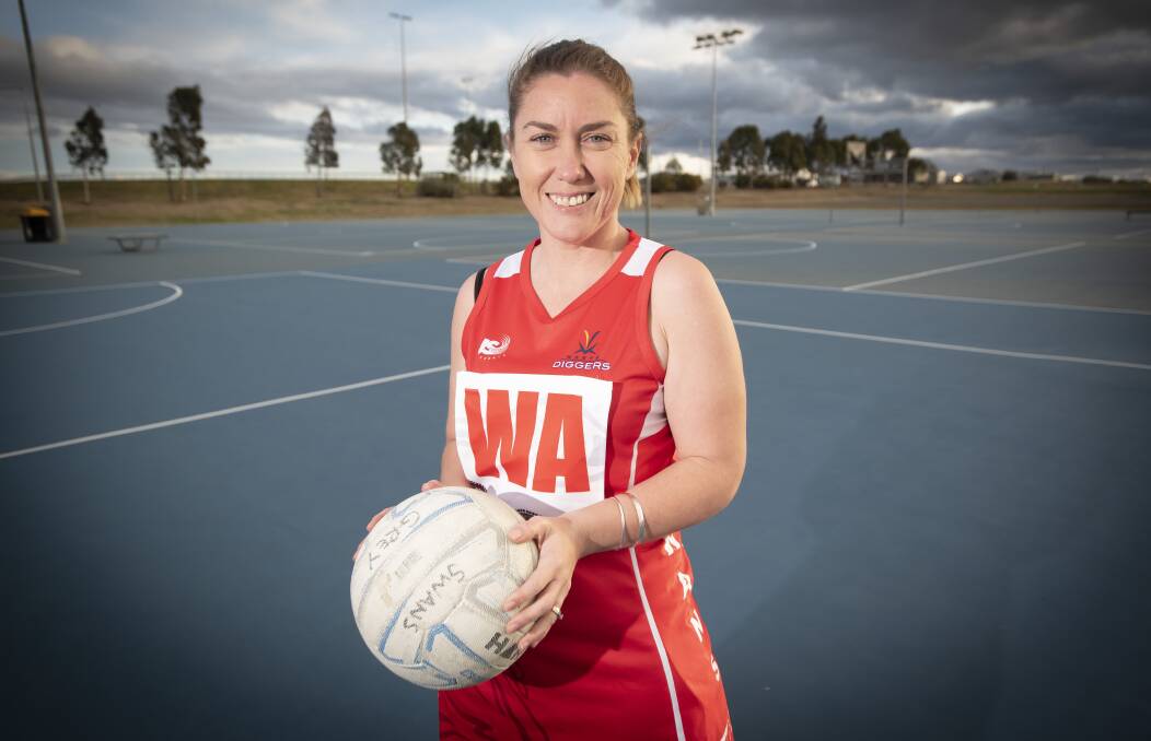 Looking good: Hannah McKenzie shows off the bib which will be proudly worn by all of the Tamworth Swans' players this weekend. Photo: Peter Hardin.