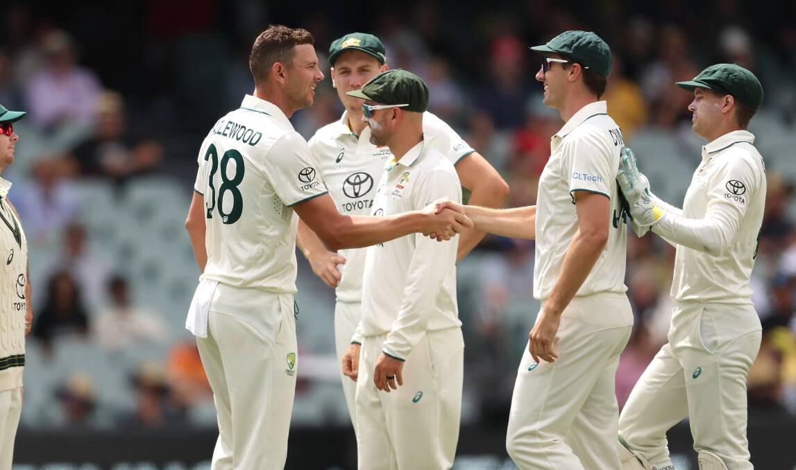 Josh Hazlewood celebrates his 250th Test wicket with his captain and fellow fast bowler, Pat Cummins. Picture by Paul Kane/Getty Images. 
