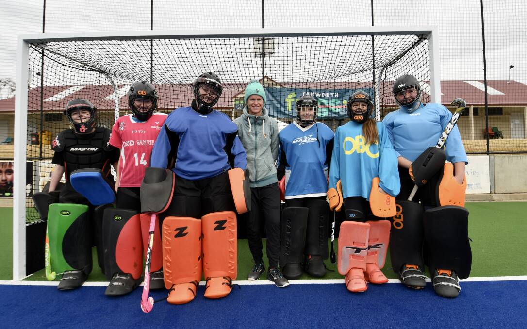Brush with the best: Local junior goalkeepers had the chance to learn from former Hockeyroo Toni Cronk (centre) on Friday. Photo: Gareth Gardner