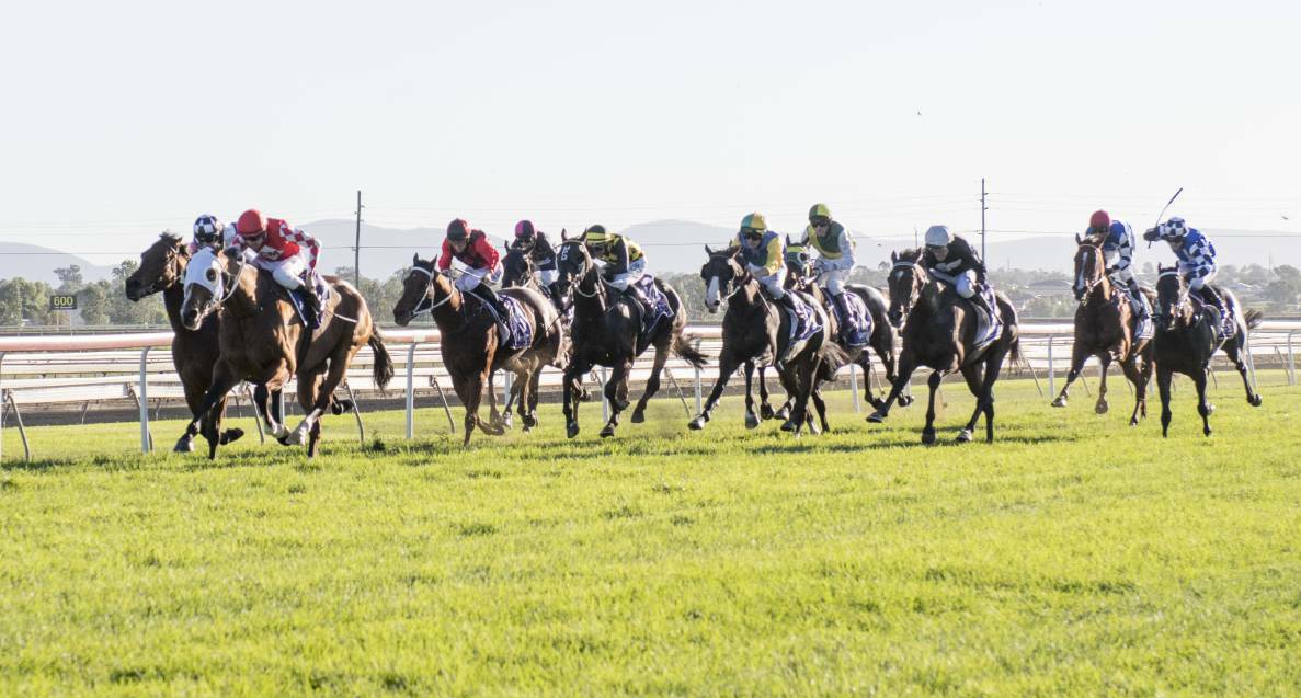 Going ahead: Unbiased storms down the outside to win last year's Tamworth Cup. This year's meeting is set to go ahead as scheduled on April 26 despite crowds not being permitted to attend. Photo: Peter Hardin