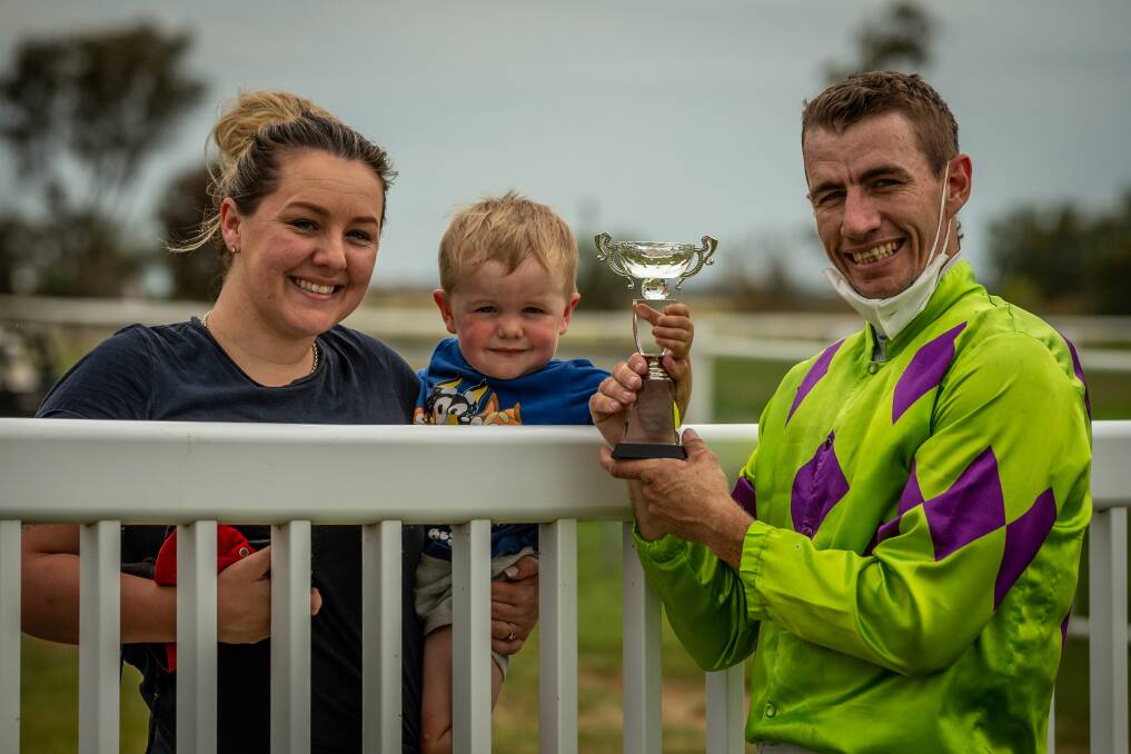 Special moment: Brent Evans with fiancé Mandy Burke and son Bryce following his win in the NSWPRA Picnic Champion Series final aboard the Brett Robb trained, On A Promise. Photo: Racing Photography.