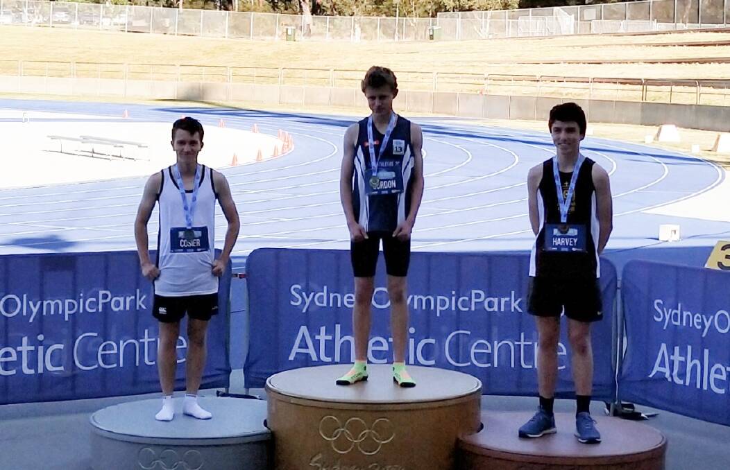 Golden run: McCarthy's Liam Gordon (centre) will be winging his way to Perth in December after winning the 13 years boys 400m at the NSW All Schools Championships on the weekend. Photo: Supplied.