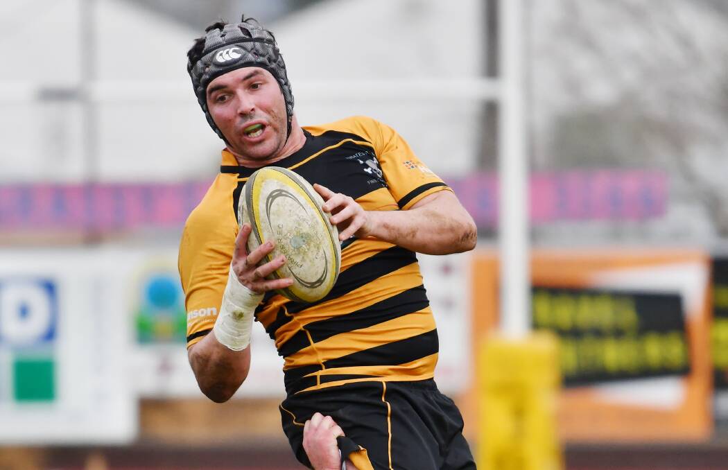 On the ball: Doug Biffin chalked up his 100th game for Pirates in the major semi-final and is hoping to top it off with a premiership. Photo: Barry Smith