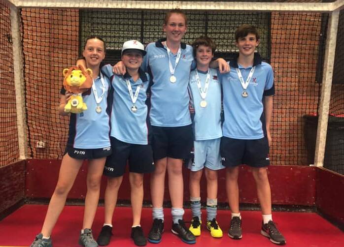 Hear them roar: The Hockey New England under-13s contingent with their medals. Photo: Supplied