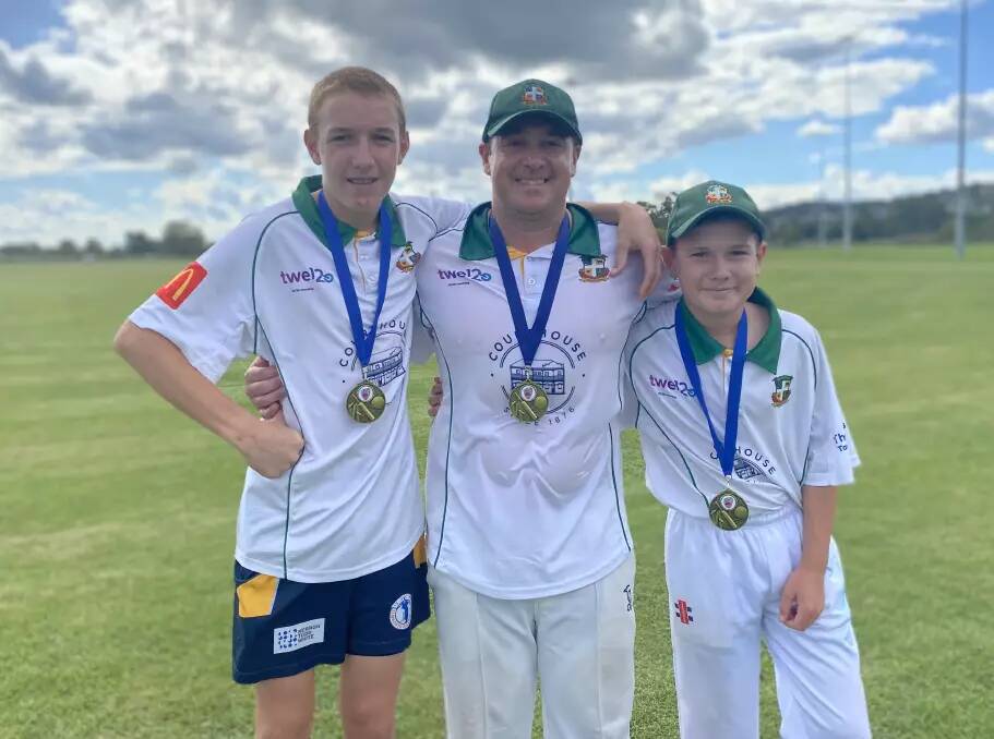 Riley, dad Adam and younger brother Cooper, celebrate after winning the 2022-23 fourth grade premiership together.