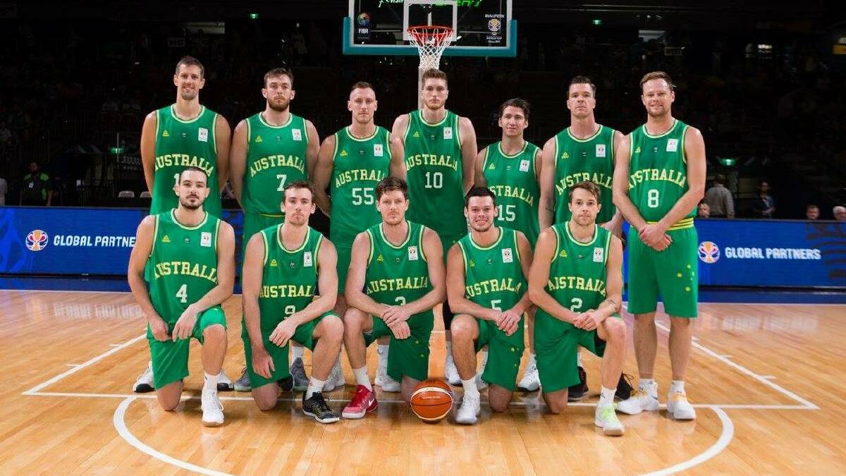 Donning the green and gold: Nick Kay (back second from left) with his Aussie team-mates before their game against Japan. Photo: Supplied.