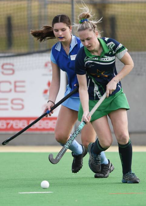 On the attack: Sarah Dicker surges forward for Services during their clash with Olympians on Sunday. Photo: Gareth Gardner