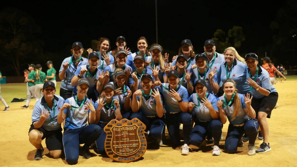 Unstoppable: Stacey Porter (front, from the right) and her NSW Firestars team celebrate a fourth successive Gilley's Shield.
