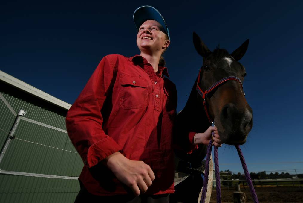 Tree change: Now Ballina-based jockey Yvette Lewis, pictured here at Sue Grills' stable last year, rode the Lea Selby-trained Invincible Faith to victory at Sunday's Coffs Harbour meeting. Photo: Gareth Gardner
