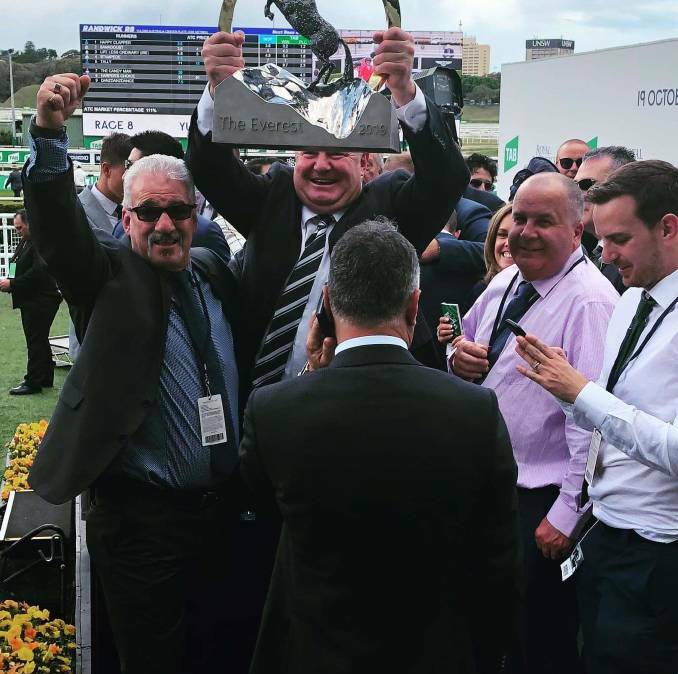 Wonderful memories: Jim Dedes (left) and Harley Payne hold The Everest trophy after Yes Yes Yes stormed home to win the world's richest race on turf last year. The colt has unfortunately been forced to retire with a tendon injury. Photo: Supplied.