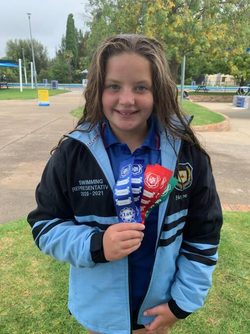 All smiles: Hope Smith's performance over the primary carnival saw the Timbumburri swimmer named the North West junior girls champion.