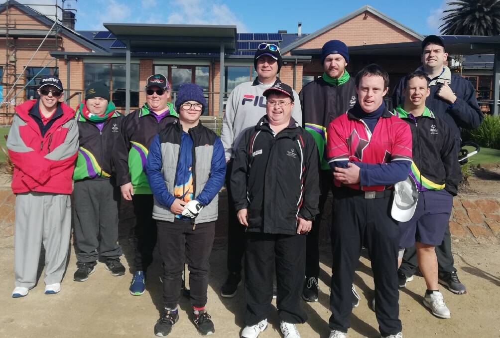 Winning round: Nat (back third from right) won the 18-hole event at the Special Olympics tournament held in Armidale on Sunday.