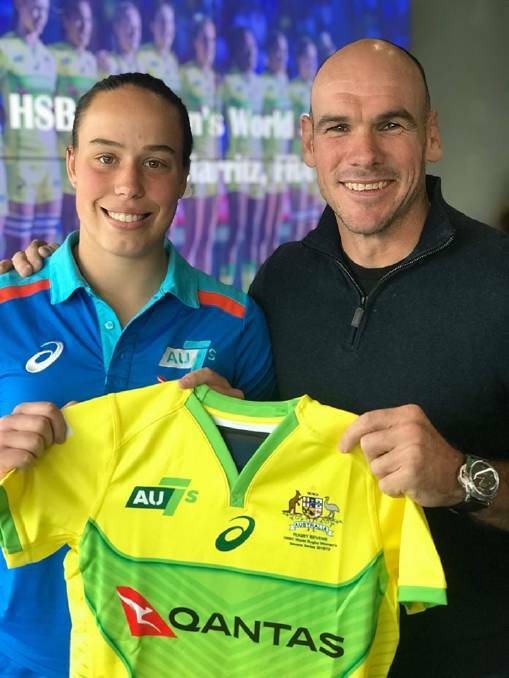 Special moment: Rhiannon Byers receives her Australian jersey from Nathan Grey.