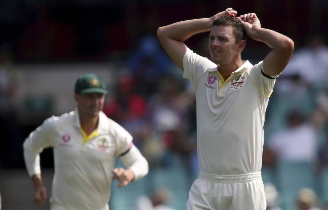 Frustration: As he prepares to head over to England, a still disappointed Josh Hazlewood says he is barely watching the World Cup. Photo: AP Photo/Rick Rycroft