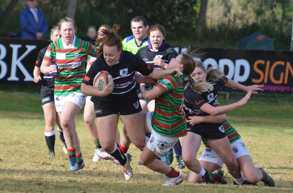 Out of my way: Jess Slade gives a would-be Albies defender the brush off during Saturday's second game.