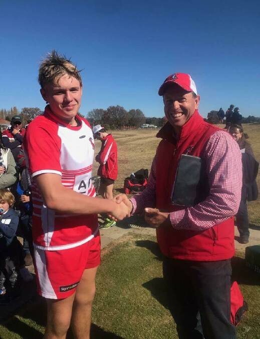 Tamworth's Mitchell Watts, here being congratulated by coach Tony Mills, was named best forward for the Central North under-16s and in the NSW Country squad.