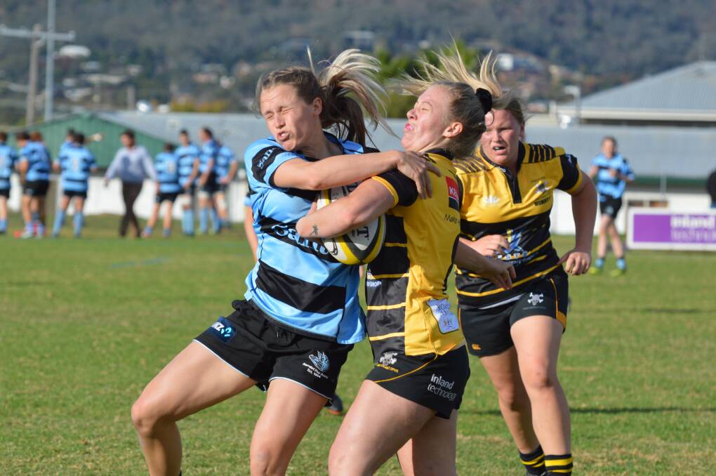 Narrabri's Tenayah Woodward and Pirates' Alice O'Connor brace for impact as Woodward affects this tackle. 