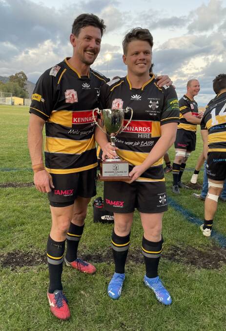 Reward: Brendan Rixon and Tim Collins, who shared the captaincy duties for Pirates on Saturday with Rixon taking over when Collins was forced off, with the Kookaburra Challenge Cup which they are now the holders of.