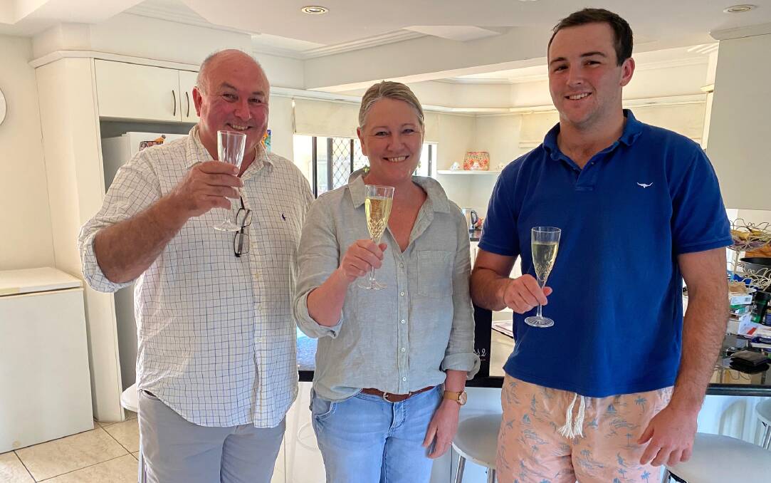 Cheers: Harry's dad Cameron, mum Mandy and brother Will share a celebratory champagne before his debut. 
