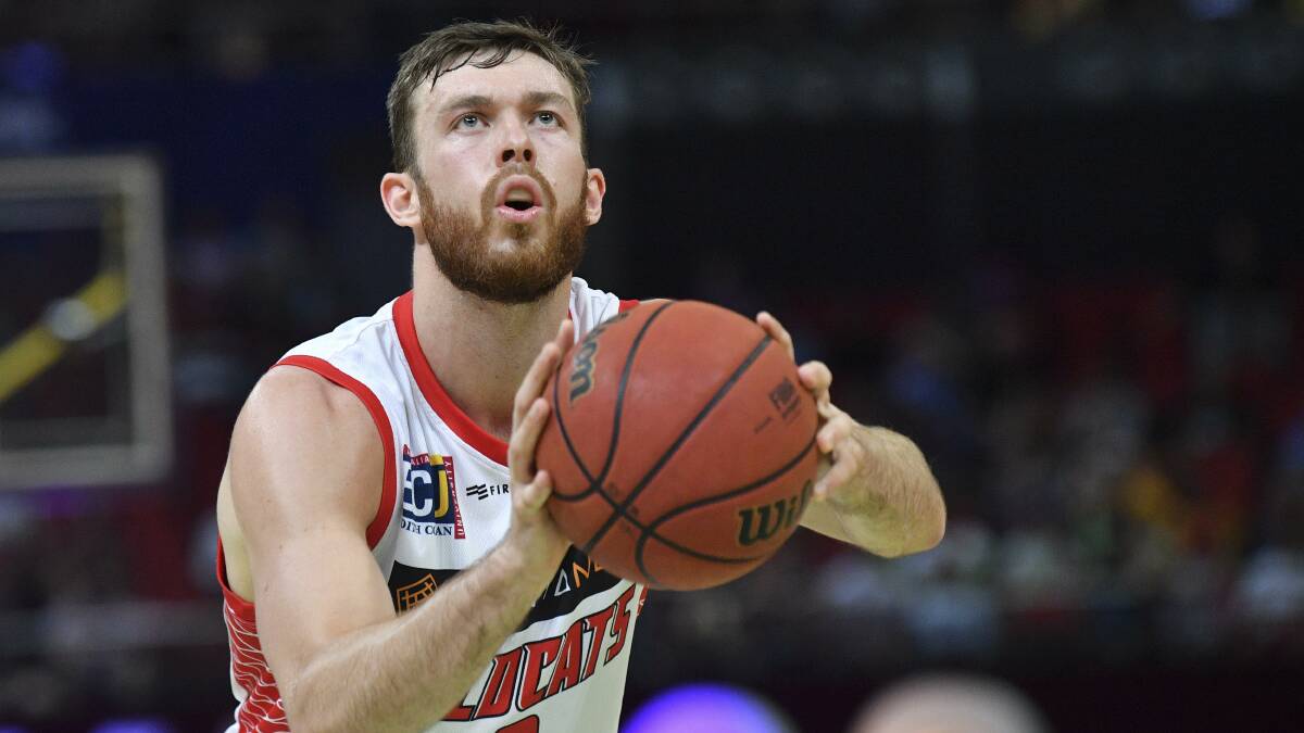 Nick Kay's Perth Wildcats had a thrilling overtime win over Sydney on Sunday to go to the top of the standings. Photo: AAP Image