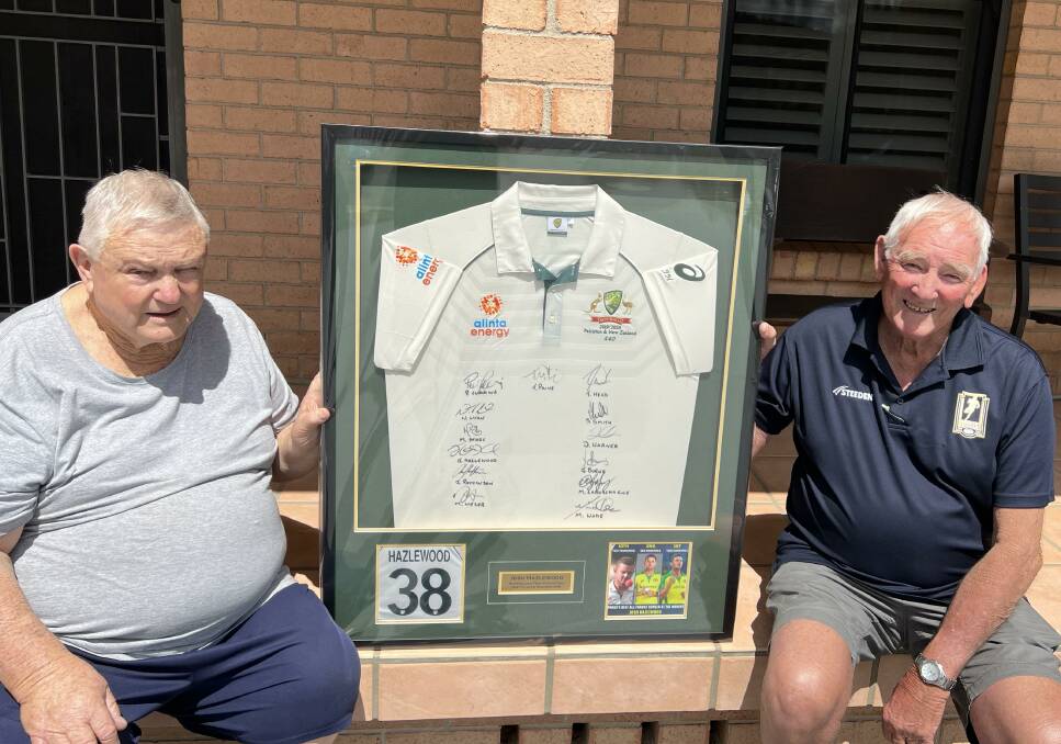 Tamworth Men of League treasurer Peter Johnson (left) and vice-president Ron Surtees (right) with the Josh Hazlewood Australian shirt which will be the major item in an auction as part of the Mick Fisher Memorial Bowls Day at Bendemeer.