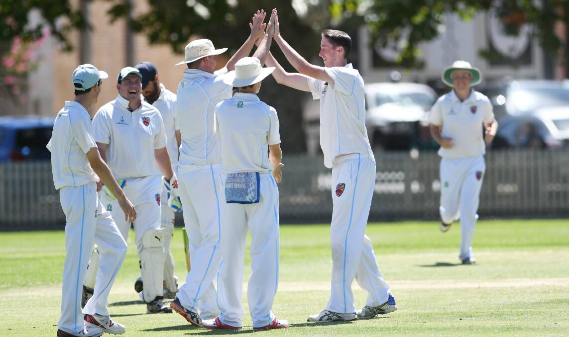 Brody Blackett-Gregg (right) is congratulated by skipper Ben Middlebrook after one of his four wickets. Photo: Gareth Gardner