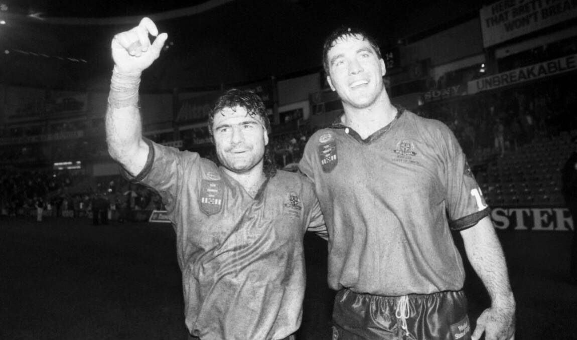 NSW legend, Benny Elias (left), pictured here with Bradley Clyde after the Blues' 14-12 game two win in 1991 is headed to Tamworth on Wednesday. Photo: Craig Golding