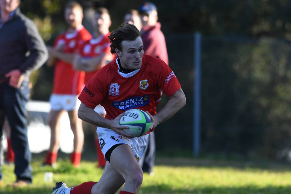 Trytime: Sam Crane crosses for the first of his double against Quirindi on Saturday. He was one of three Red Devils to score twice in their win. Photo: Samantha Newsam