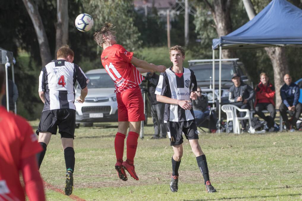 Jake McCann heads this ball away for Norths United. He was one of their goalscorers in their two goal win over North Companions on Saturday. Photo: Peter Hardin 110519PHF083